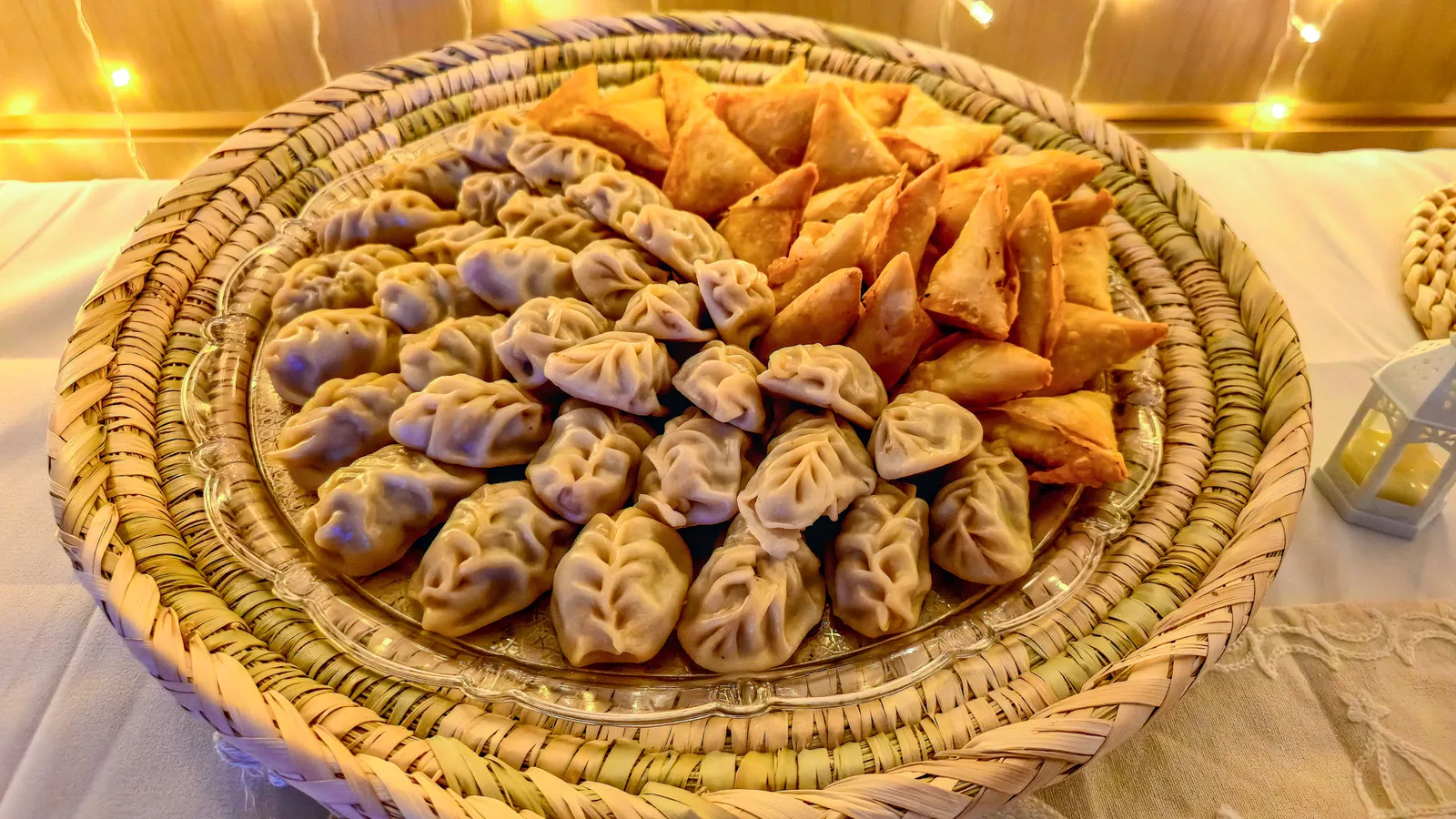 South Indian catering spread with copper serving trays at a decorated event table
