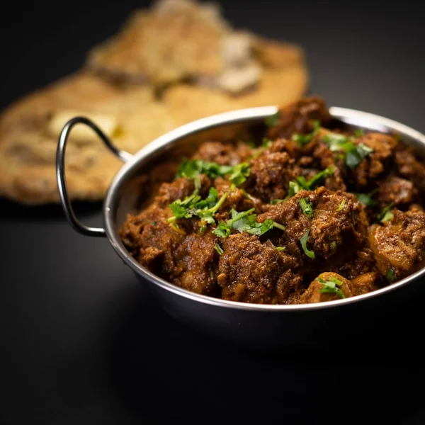 Dark Chettinad chicken curry with Guntur chilies, kalpasi and curry leaves